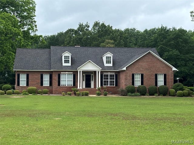 new england style home with a front yard