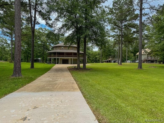 exterior space featuring a wooden deck and a front lawn