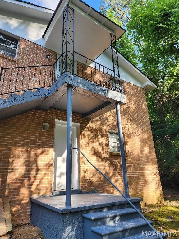 view of home's exterior with a balcony