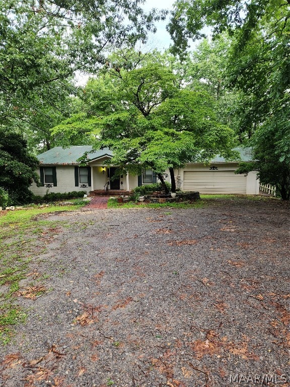 ranch-style home with a garage