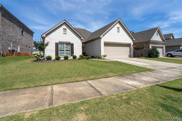 view of front of home featuring a garage and a front lawn