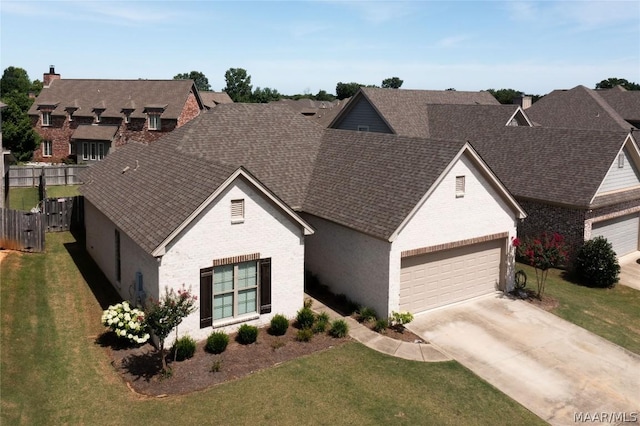 view of front of house with a front lawn and a garage