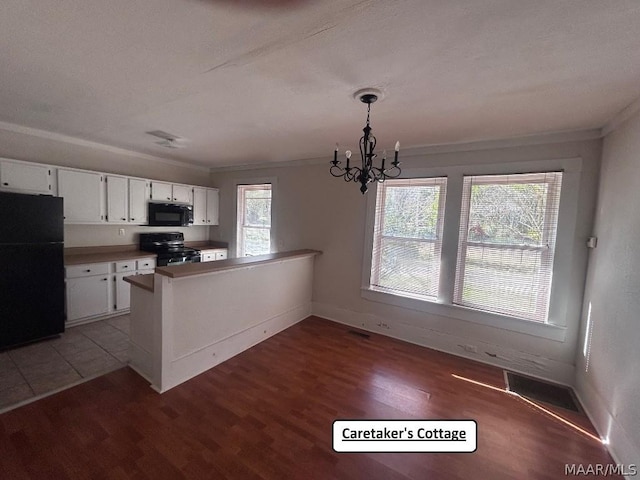 kitchen featuring ornamental molding, a peninsula, black appliances, white cabinetry, and pendant lighting