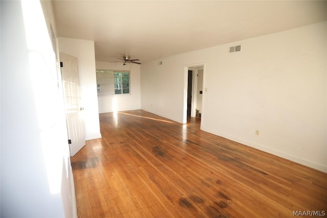 spare room with ceiling fan and hardwood / wood-style floors