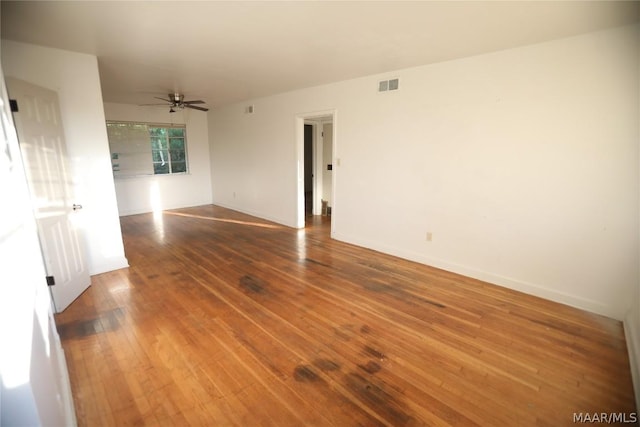 unfurnished room featuring ceiling fan and wood-type flooring