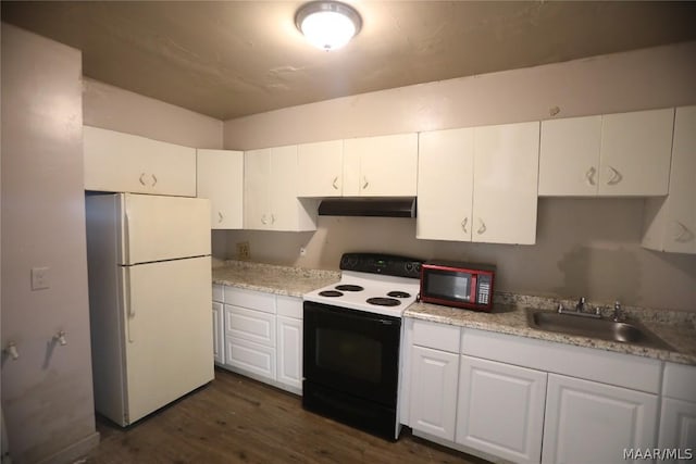 kitchen with white fridge, white cabinets, range with electric stovetop, and sink