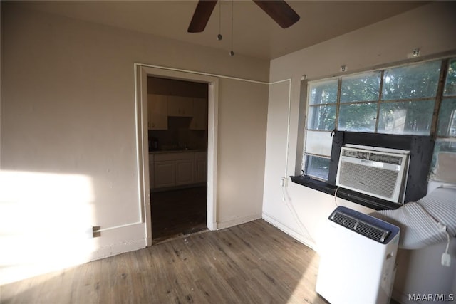 kitchen with ceiling fan, cooling unit, and wood-type flooring