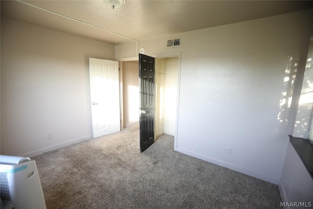 unfurnished bedroom featuring carpet