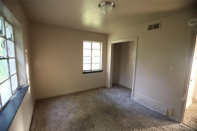 unfurnished room with carpet