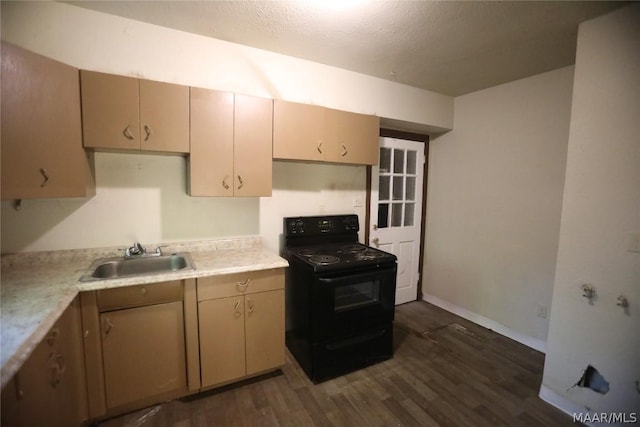 kitchen with electric range, dark wood-type flooring, a textured ceiling, and sink