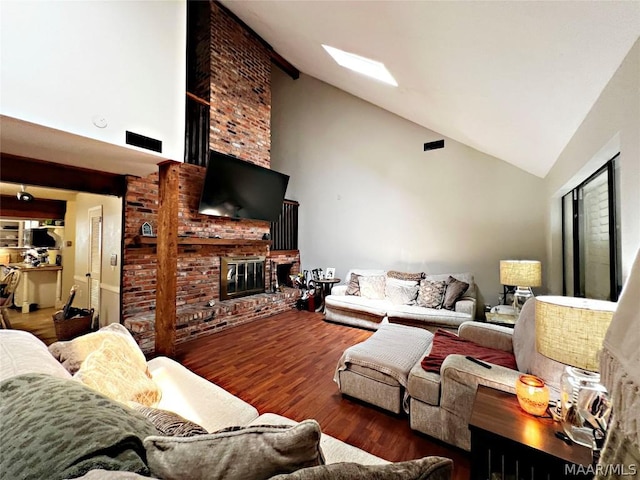 living room featuring a fireplace, high vaulted ceiling, and hardwood / wood-style flooring