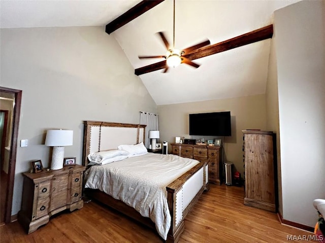 bedroom featuring vaulted ceiling with beams, ceiling fan, and light hardwood / wood-style flooring