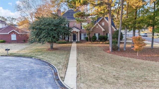 view of front of home with a front lawn