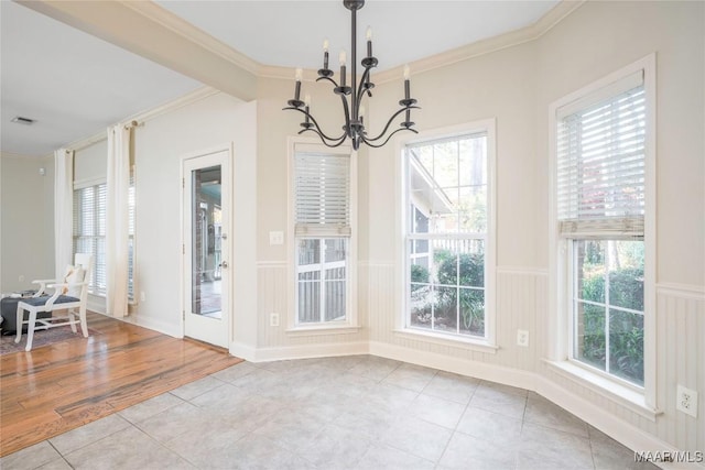 dining room featuring light hardwood / wood-style flooring, plenty of natural light, and ornamental molding