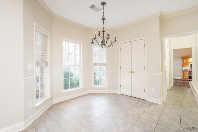 unfurnished dining area featuring light tile patterned floors, a notable chandelier, and ornamental molding