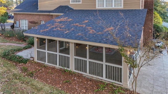 view of side of property with a sunroom