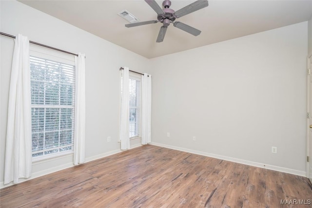 empty room featuring ceiling fan and wood-type flooring