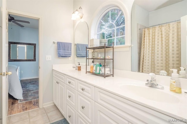 bathroom featuring tile patterned flooring, ceiling fan, and vanity