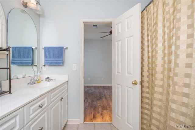 bathroom with vanity, hardwood / wood-style flooring, and ceiling fan