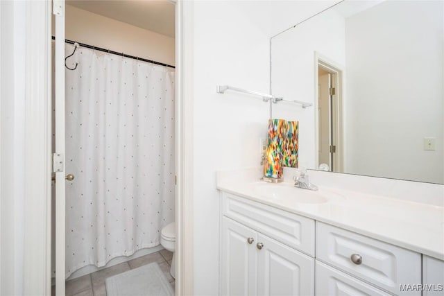 bathroom featuring tile patterned flooring, vanity, toilet, and a shower with shower curtain