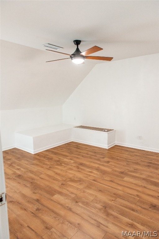 bonus room with hardwood / wood-style floors, ceiling fan, and lofted ceiling