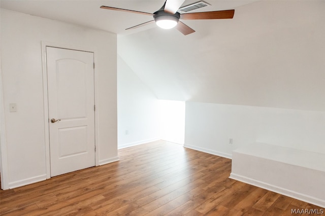 bonus room featuring hardwood / wood-style flooring, ceiling fan, and vaulted ceiling