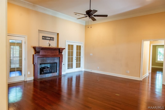 unfurnished living room featuring french doors, dark hardwood / wood-style flooring, ceiling fan, and ornamental molding