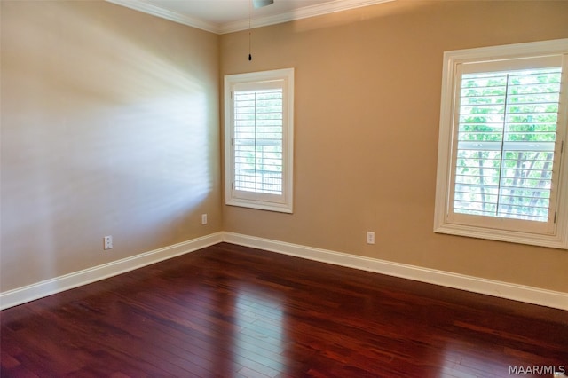 unfurnished room featuring dark wood-type flooring and ornamental molding