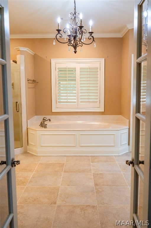 bathroom with ornamental molding, a bath, and a chandelier