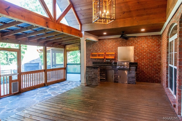 unfurnished sunroom with plenty of natural light, ceiling fan, and ornate columns