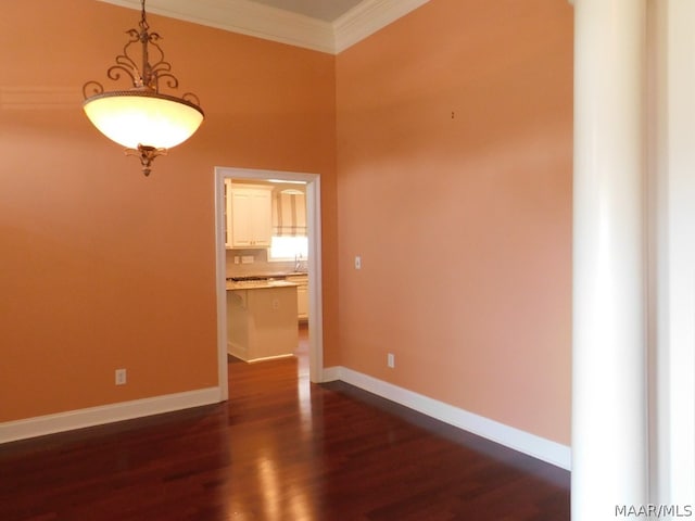 unfurnished room with dark hardwood / wood-style floors and ornamental molding