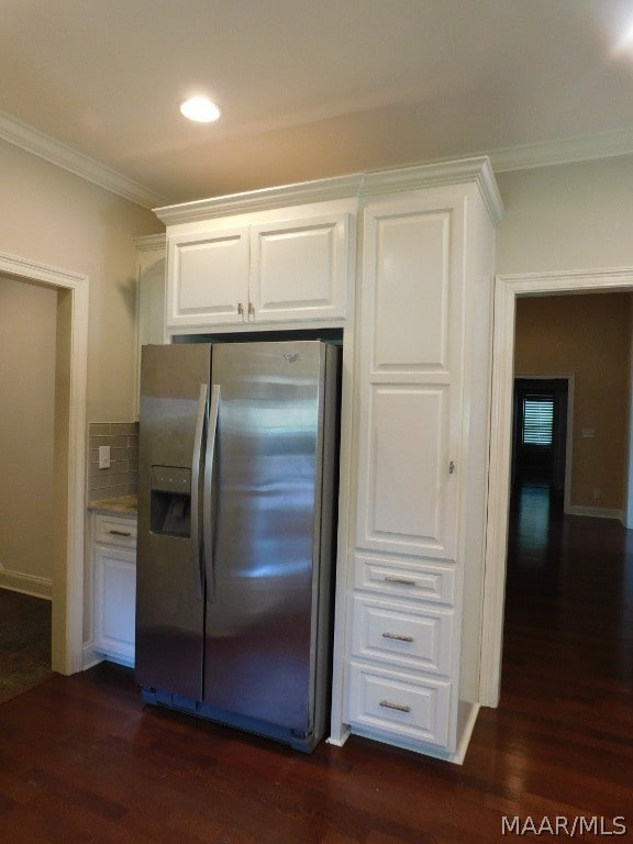 kitchen featuring white cabinets, dark hardwood / wood-style floors, stainless steel fridge with ice dispenser, and backsplash