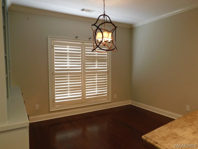 unfurnished dining area featuring a healthy amount of sunlight, an inviting chandelier, dark wood-type flooring, and crown molding