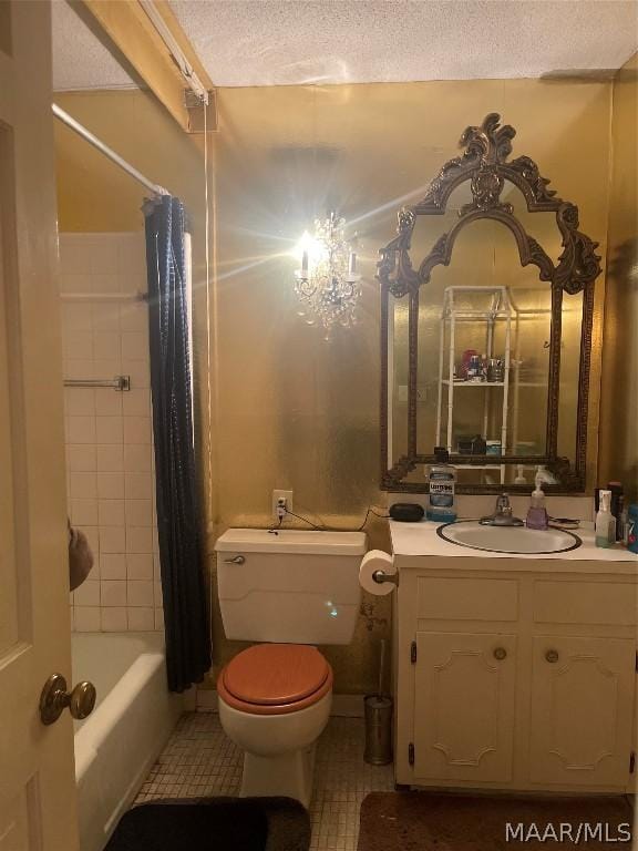 full bathroom featuring vanity, tile patterned floors, shower / bath combination with curtain, toilet, and a textured ceiling