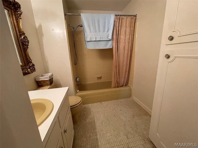 full bathroom with vanity, shower / bath combo, and toilet