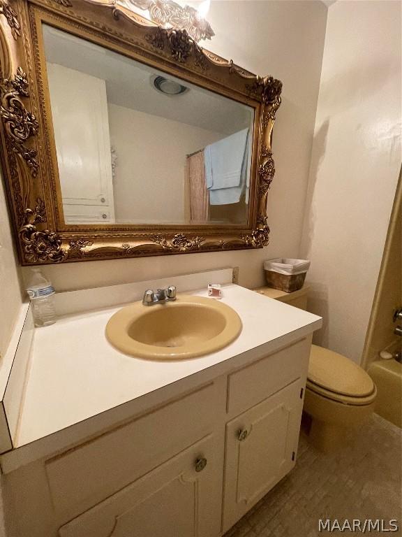 bathroom with vanity and toilet