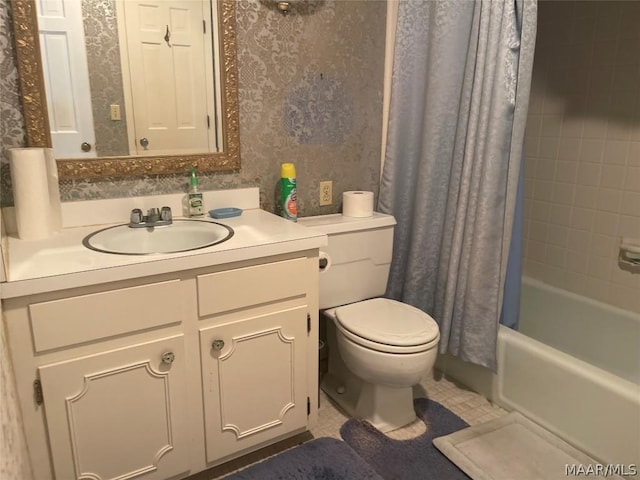 full bathroom with tile patterned floors, shower / tub combo with curtain, vanity, and toilet