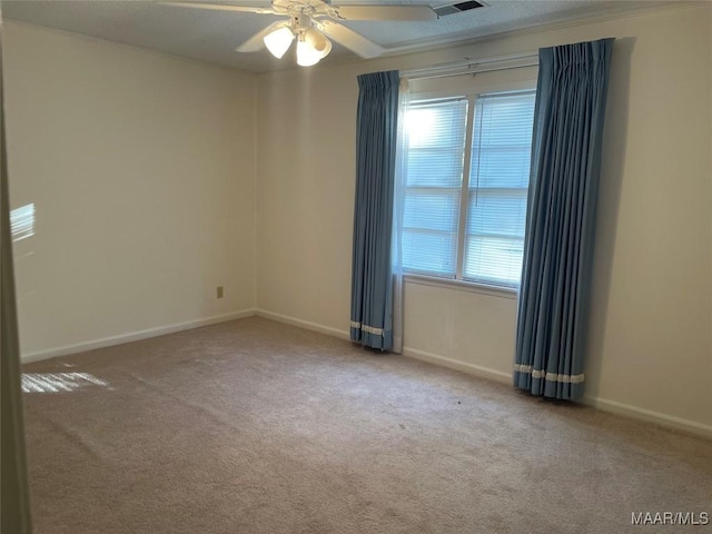 unfurnished room featuring ceiling fan and carpet floors