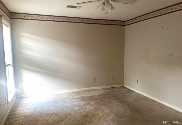 spare room featuring carpet flooring and ceiling fan