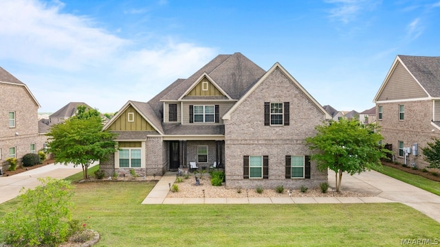 craftsman-style home with a front lawn