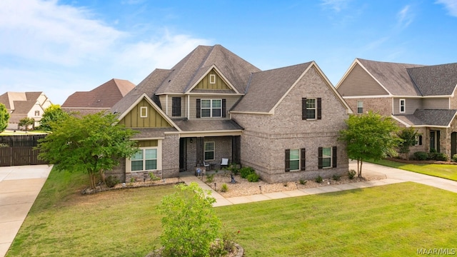 craftsman inspired home with a front yard