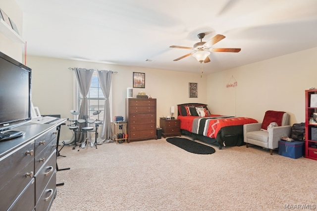 bedroom featuring ceiling fan and light colored carpet