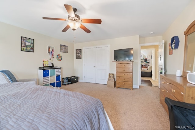 bedroom with carpet, a closet, and ceiling fan