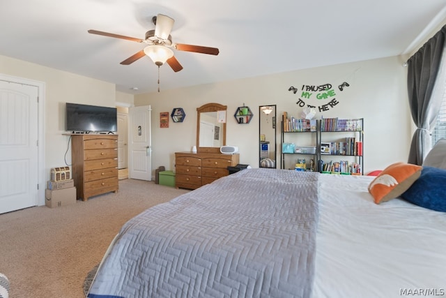 bedroom featuring ceiling fan and light colored carpet