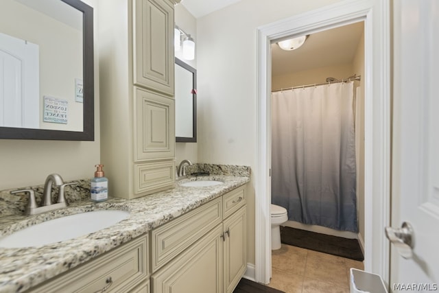 bathroom featuring tile patterned flooring, vanity, toilet, and a shower with curtain