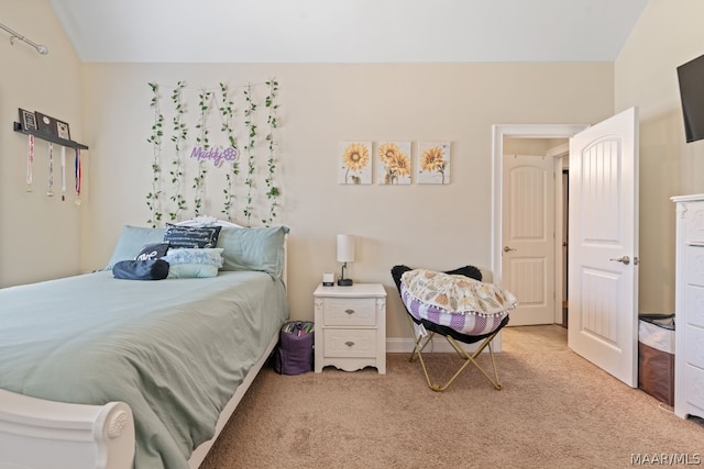 bedroom featuring light colored carpet