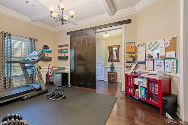 exercise area with a barn door, dark hardwood / wood-style flooring, ornamental molding, and an inviting chandelier