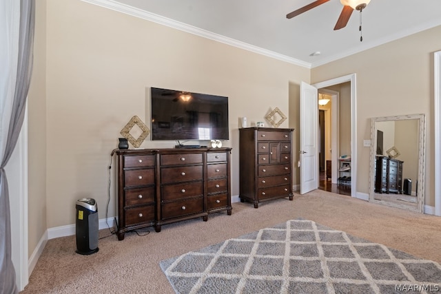 bedroom featuring light colored carpet, ceiling fan, and ornamental molding