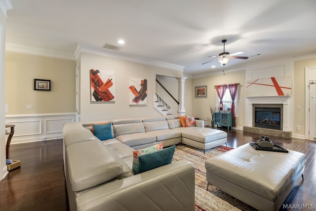 living room with ceiling fan, dark hardwood / wood-style floors, and ornamental molding