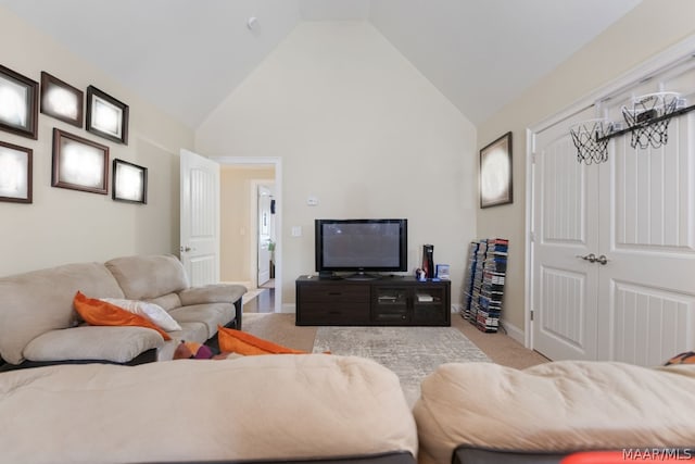 living room featuring light carpet and lofted ceiling